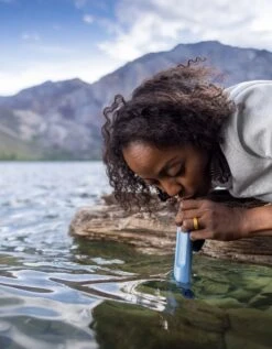 LifeStraw Peak Series Personal Straw Water Filter -Outdoor Research Store LifeStraw PEAK Personal Mountain Blue Lifestyle Drinking Woman Adam Barker 03 1000x b6fa166e 4765 494f 89c3 f3443ad5679c