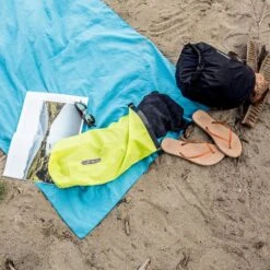 ORTLIEB Ultralight PS10 Dry Bag -Outdoor Research Store ORTLIEB Ultralight PS10 Dry Bag Roll Lifestyle Beach