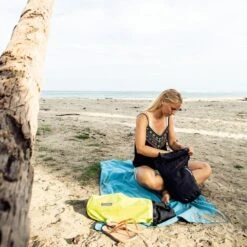 ORTLIEB Ultralight PS10 Dry Bag -Outdoor Research Store ORTLIEB Ultralight PS10 Dry Bag Roll Lifestyle Beach 2